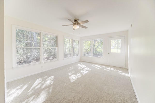 unfurnished sunroom with plenty of natural light and ceiling fan