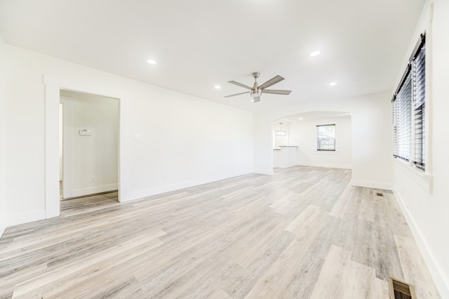 unfurnished living room with light hardwood / wood-style floors and ceiling fan