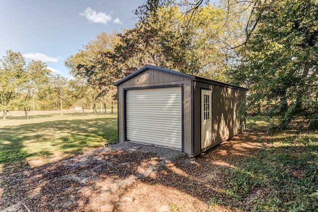 garage featuring a yard