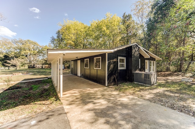 view of property exterior with a carport