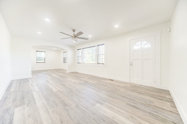 interior space with light hardwood / wood-style floors and ceiling fan