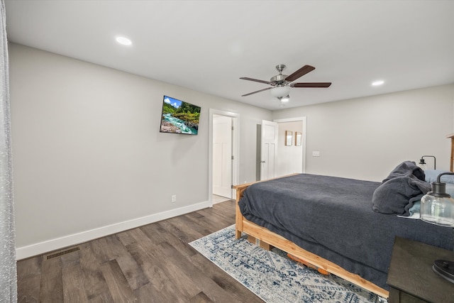 bedroom featuring dark hardwood / wood-style floors and ceiling fan