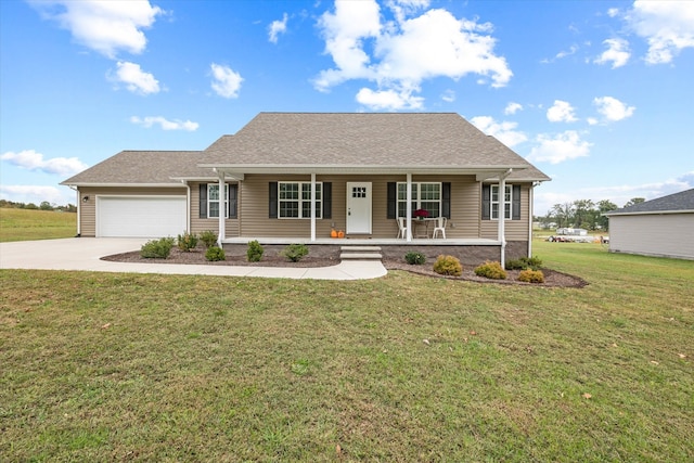 view of front of house with a front lawn, covered porch, and a garage