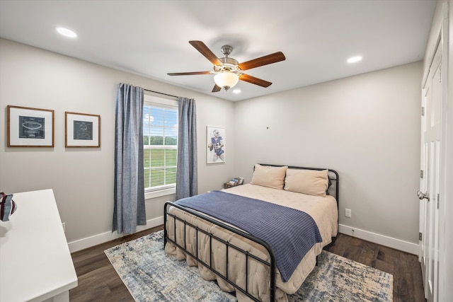 bedroom with dark wood-type flooring and ceiling fan