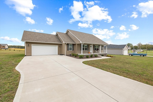 view of front of home with a porch, a front lawn, and a garage