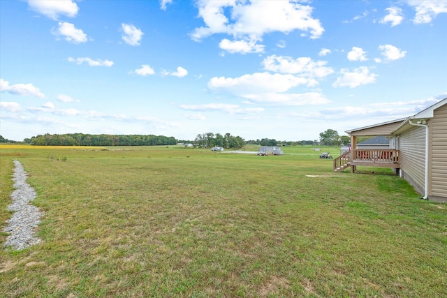 view of yard with a rural view