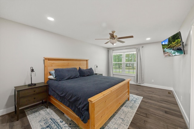 bedroom with dark wood-type flooring and ceiling fan