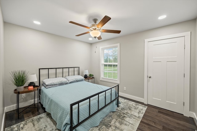 bedroom featuring dark hardwood / wood-style floors and ceiling fan