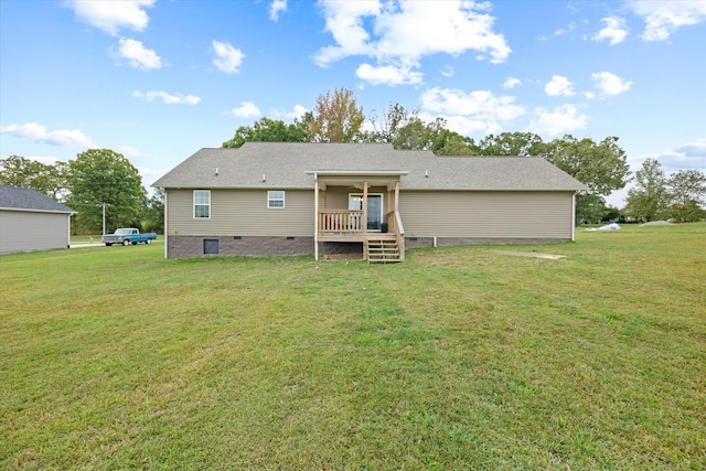 rear view of property with a lawn