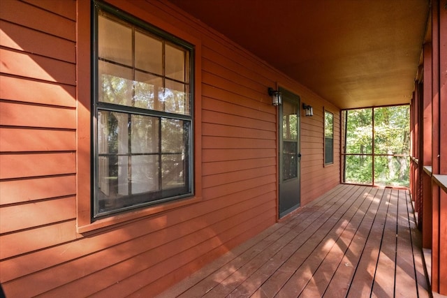 wooden terrace with a porch