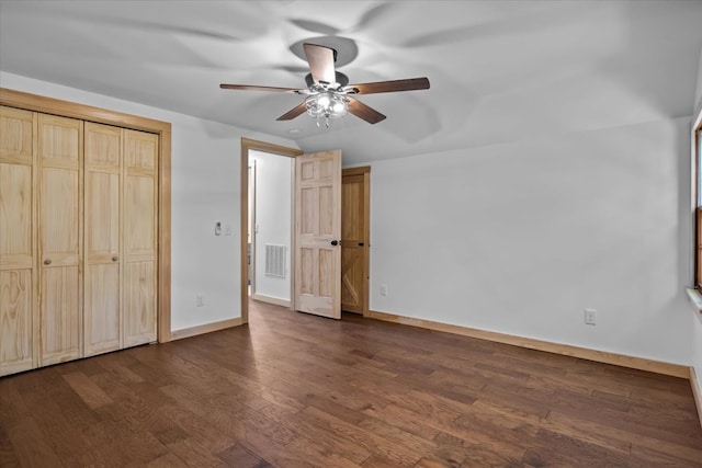 unfurnished bedroom with dark hardwood / wood-style flooring and ceiling fan