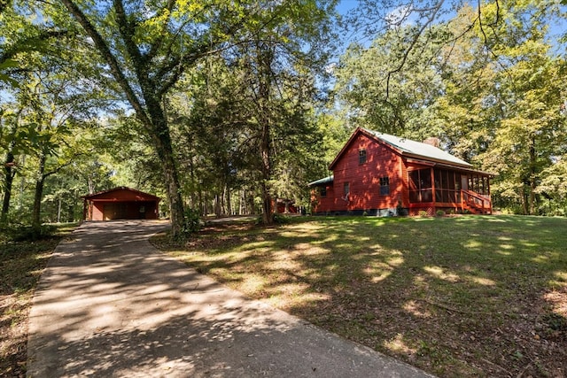 exterior space featuring a garage and an outdoor structure