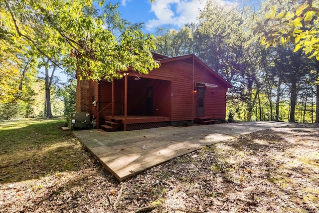 view of side of home featuring a patio area