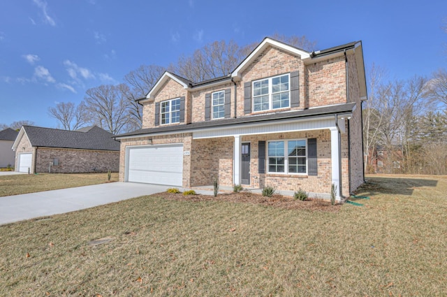 view of front of property featuring a porch, a garage, and a front lawn