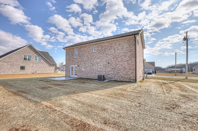 back of house with central AC