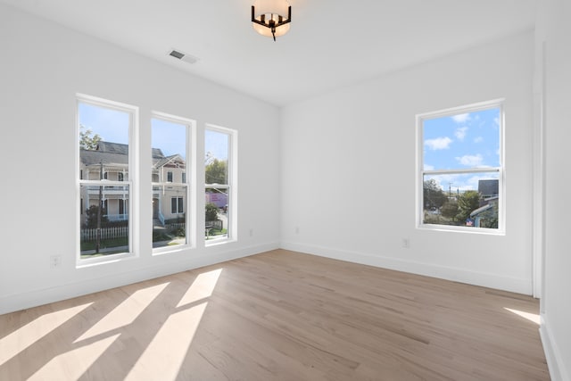 spare room featuring light hardwood / wood-style floors