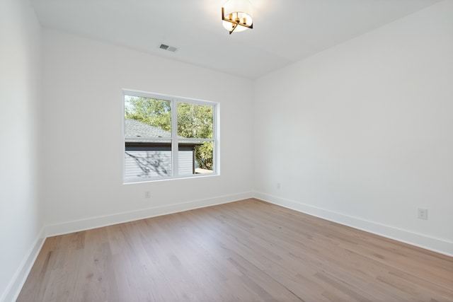 unfurnished room featuring light hardwood / wood-style floors