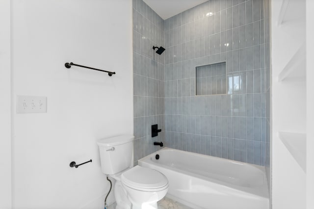 bathroom with toilet and tiled shower / bath combo