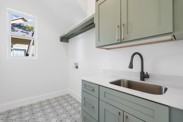 kitchen with sink and green cabinetry