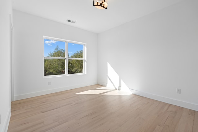 spare room featuring light hardwood / wood-style floors