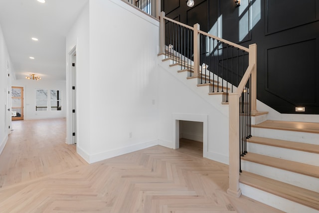 stairway with parquet flooring