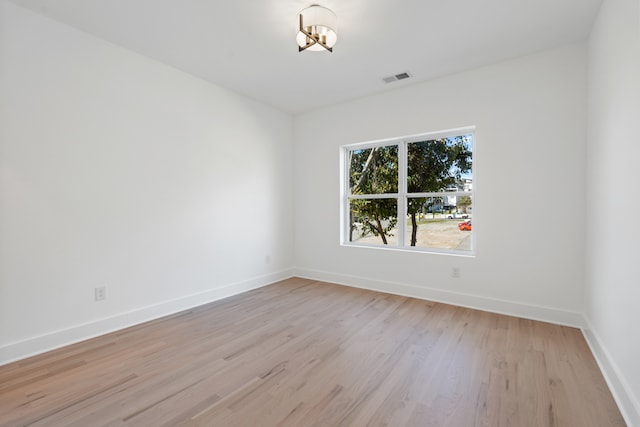 spare room with light hardwood / wood-style floors