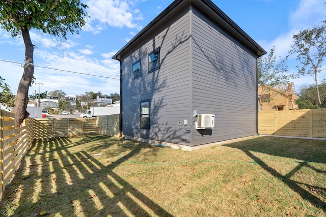 view of side of home featuring a yard