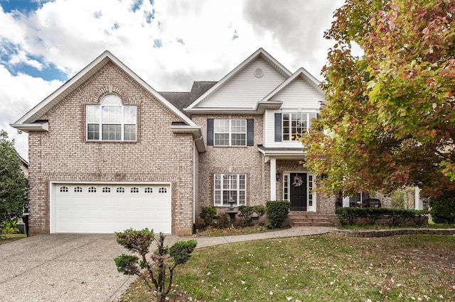 view of front property with a front yard and a garage