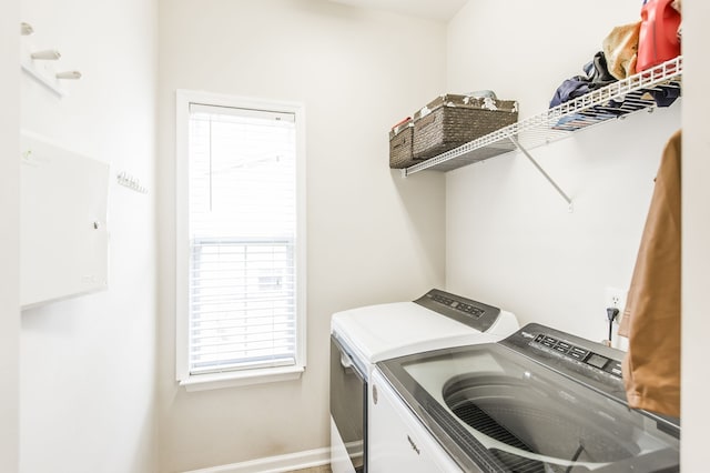 washroom with independent washer and dryer and plenty of natural light