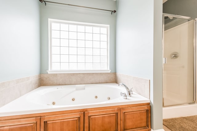 bathroom with separate shower and tub