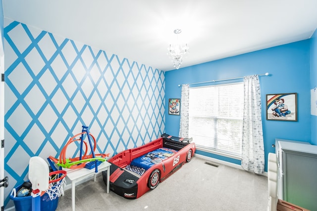 bedroom with a chandelier and carpet