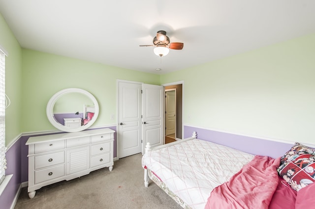 bedroom featuring ceiling fan and light colored carpet