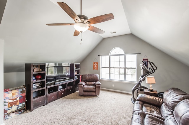 living room with ceiling fan, vaulted ceiling, and carpet floors