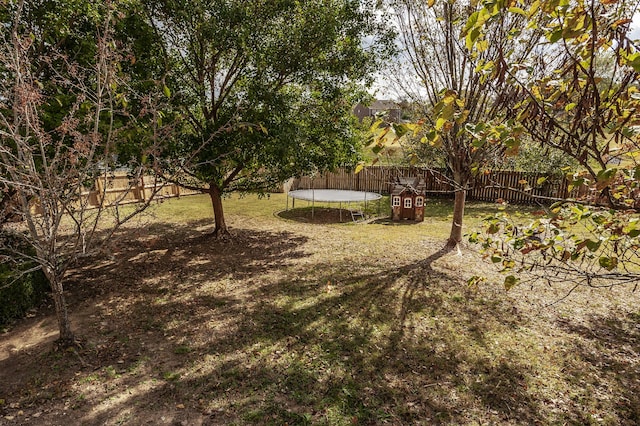 view of yard featuring a trampoline