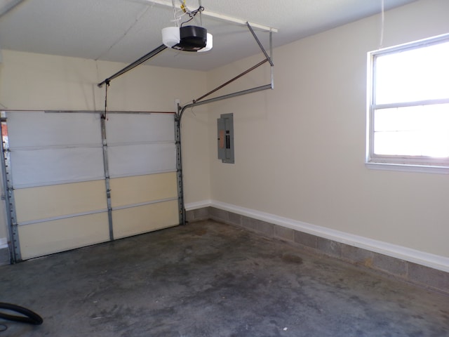 garage featuring a garage door opener and electric panel