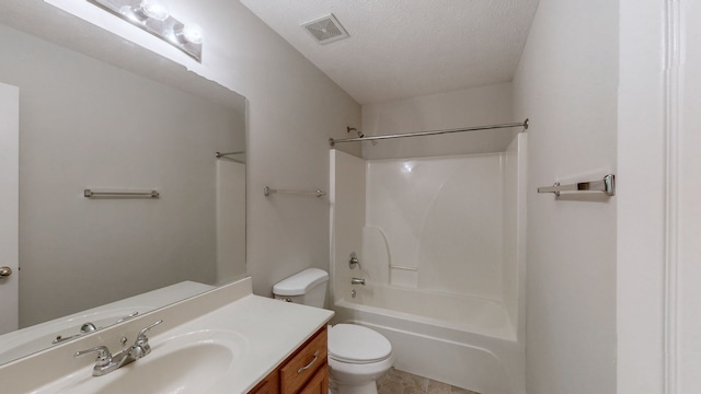 full bathroom featuring vanity, shower / bath combination, a textured ceiling, and toilet