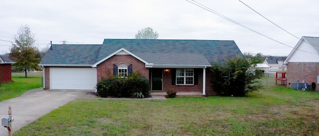 view of front of home with a garage and a front lawn