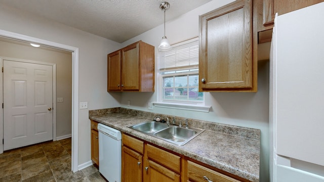 kitchen with dishwasher, a textured ceiling, hanging light fixtures, and sink