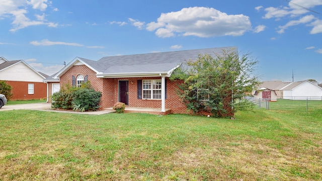 view of front of home with a front yard and a garage