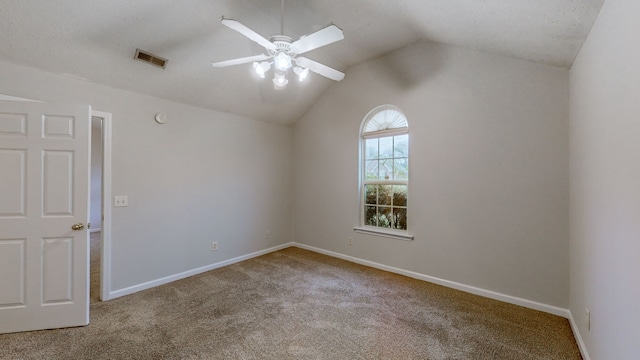 empty room with carpet, ceiling fan, and lofted ceiling