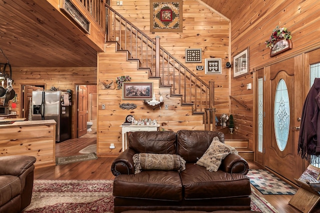 living room featuring wood ceiling, high vaulted ceiling, wood walls, and hardwood / wood-style floors