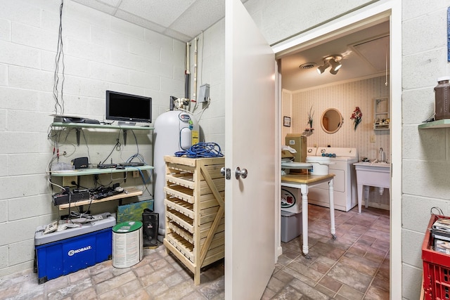 bathroom featuring washer / dryer, a paneled ceiling, and sink