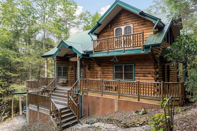 view of front of home with a balcony