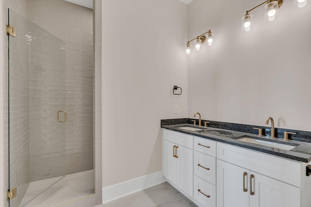 bathroom featuring tile patterned floors, vanity, and a shower with door