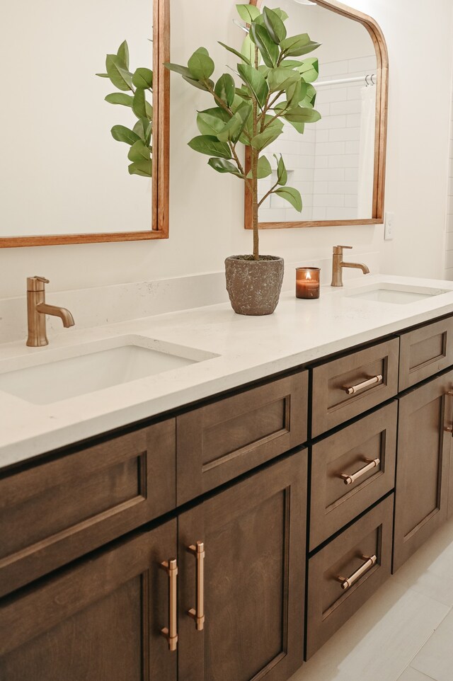 bathroom with vanity and tile patterned floors