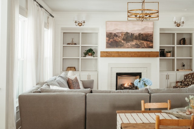 living room with a notable chandelier and wood walls