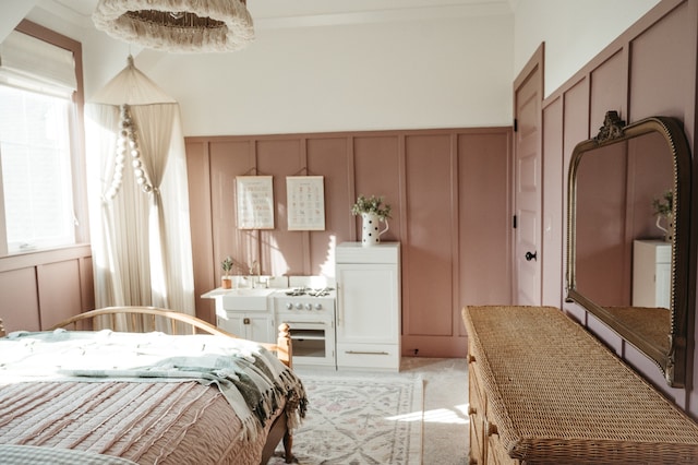 bedroom featuring light carpet