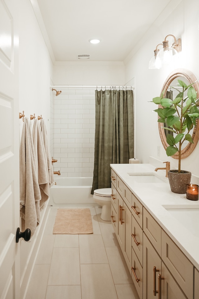 full bathroom with toilet, shower / tub combo with curtain, vanity, and tile patterned flooring