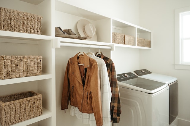 laundry room with washing machine and clothes dryer