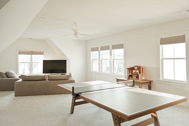 playroom with ceiling fan and light colored carpet